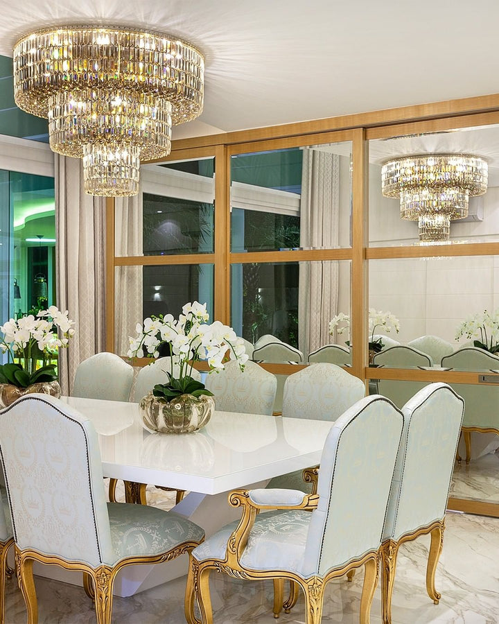 Dining room with a chandelier, table, and chairs.