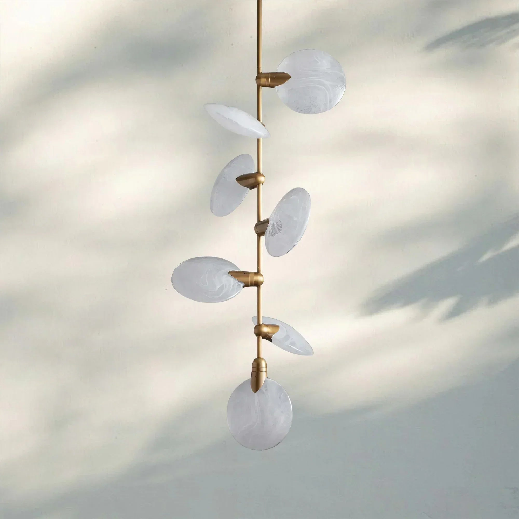 Lyla Pendant Light front view with alabaster shade and brass finish