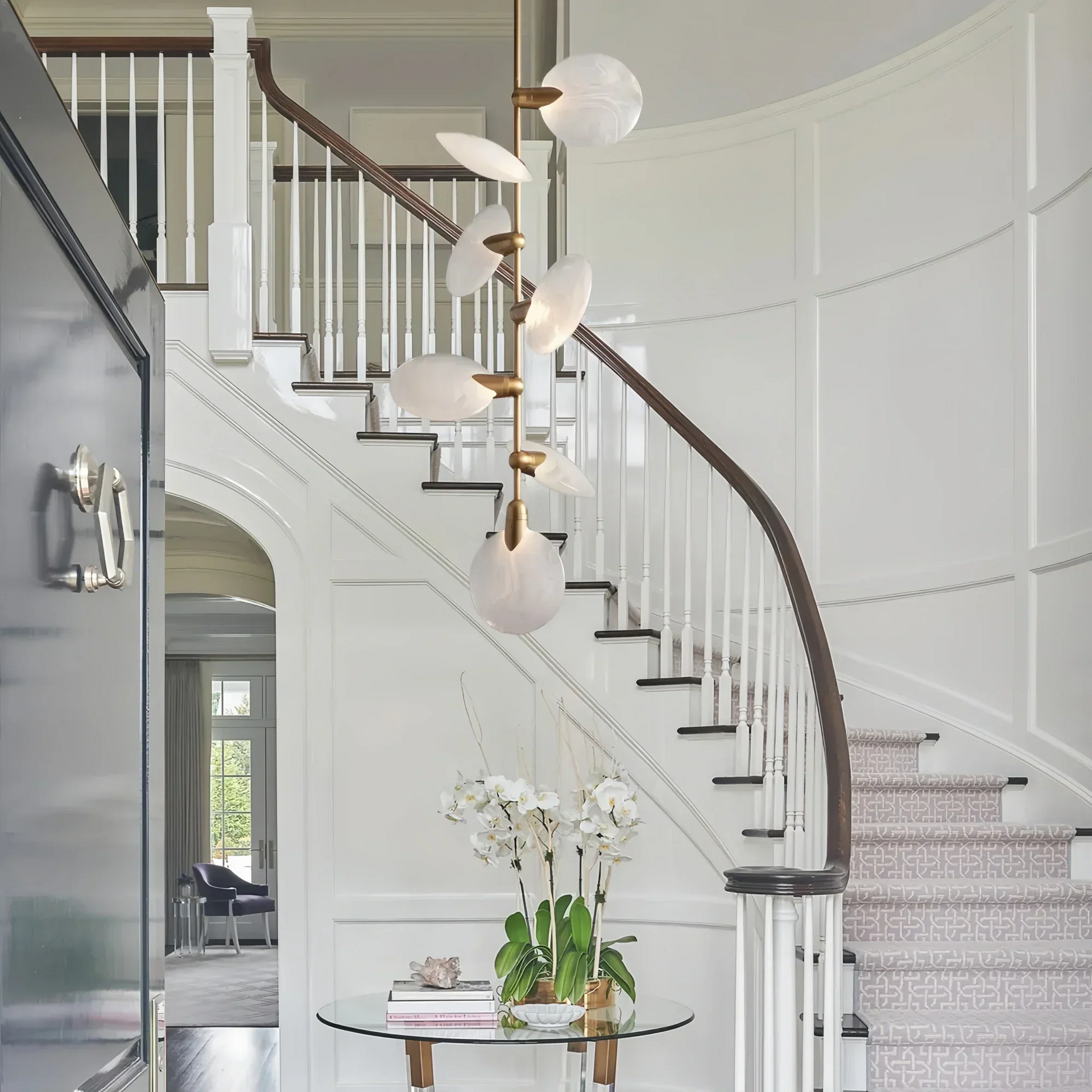 Lyla Pendant chandelier hanging in staircase with modern alabaster design