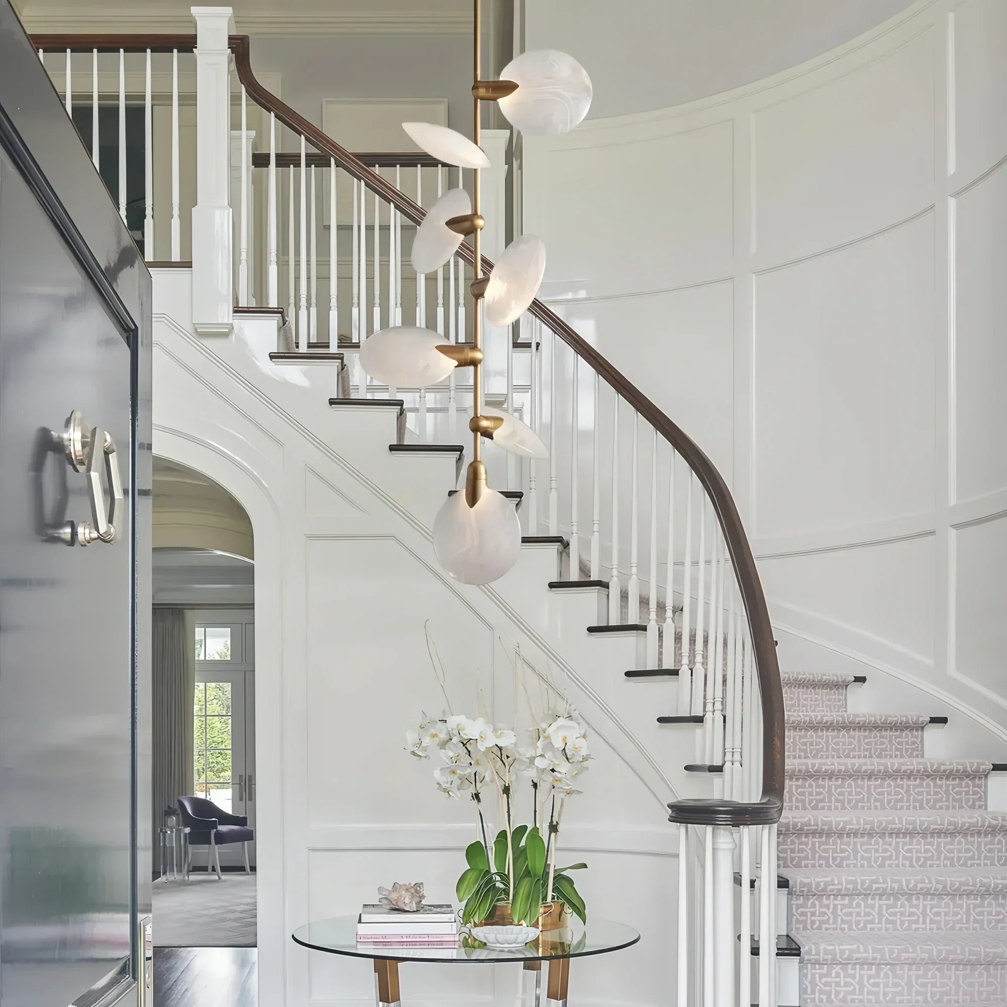 Lyla Pendant chandelier hanging in staircase with modern alabaster design